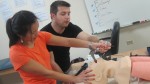 Morgan showing Irene how to not break any teeth during intubation!