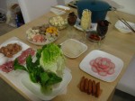 Hot Pot is a tradition in both of our families, with everyone cooking fresh meats, vegetables, noodles, fish cakes, and an assortment of other wonderful things over a steaming "hot pot" of broth in the center of the table while eating, sharing a good time together.
